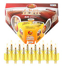 A small, clear glass Hanukkah oil cup candle pre-filled with yellow olive oil, topped with a brass wick holder and a yellow protective rubber stopper.