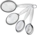Set of four stainless steel oval measuring cups with stamped handles from Cuisipro, includes 1/4 to 1 cup sizes
