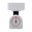 White Taylor 11lb mechanical kitchen scale with large dial and removable weighing bowl on a white background.