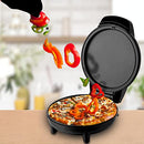 White mini griddle and pizza maker with red and green indicator lights on top, showing its compact size.