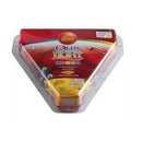 A medium-sized glass Hanukkah oil cup candle pre-filled with bright green oil, featuring a brass wick holder and a lit wick.