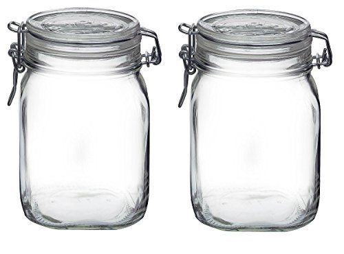 Two empty, clear glass Fido jars, each with a glass lid and a metal wire clamp closure for an airtight seal.