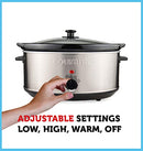 Stainless steel slow cooker with black lid and control dial.