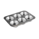Nordic Ware natural aluminum 6-cup compact muffin pan with round cavities on a white background.