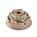 Nordic Ware copper rose-shaped Bundt pan with petal detailing and center tube on a white background.