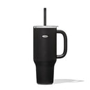 A tall, matte black OXO Strive XL tumbler with a clear lid, a black straw inserted, and a sturdy black handle on the side. The white OXO logo is visible on the tumbler's body.
