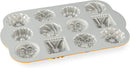 Nordic Ware Bundt Charms gold mini cake pan with 12 small Bundt cavities on a white background.