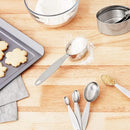 A product photo of two sets of stainless steel measuring utensils. The top image shows four measuring cups of different sizes, and the bottom image shows five measuring spoons of various sizes, held together by a ring.