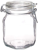 Two empty, clear glass Fido jars, each with a glass lid and a metal wire clamp closure for an airtight seal.