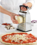 Stainless steel four-sided box grater with black handle.