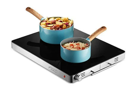  A compact black hot plate with an adjustable temperature knob, heating a pot, ideal for keeping food warm.