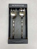 A two-piece set of elegant silver salad servers, including a spoon and fork, displayed in their dark retail packaging.