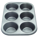 A gray metal baking pan with six round cups and a nonstick coating, perfect for muffins or cupcakes.