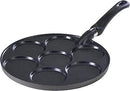 Black round pancake pan with seven circular molds and a black handle.