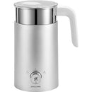 ZWILLING Enfinigy Milk Frother, a modern silver electric frother with a white handle, stainless steel top, and a control dial on the front, designed for effortlessly frothing milk.
