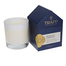 Trapp No. 8 Fresh Cut Tuberose 7 oz candle in a white glass vessel, shown beside its house-shaped gift box packaging, on a white background.
