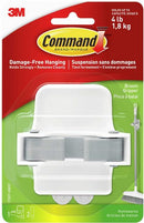 A wall-mounted broom holder from Command, showing its ability to hold a broom securely and remove without damage.
