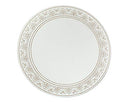Philip Whitney round mirror charger plate featuring a border of silver dots.