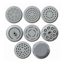 A white Starfrit electric pasta maker extruding long strands of fresh pasta. The machine has a clear top allowing a view of the dough inside. To the left, a white plate of cooked spaghetti with tomato sauce and shrimp is shown as a serving suggestion.