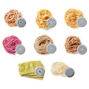 A white Starfrit electric pasta maker extruding long strands of fresh pasta. The machine has a clear top allowing a view of the dough inside. To the left, a white plate of cooked spaghetti with tomato sauce and shrimp is shown as a serving suggestion.