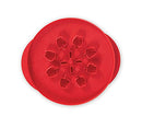 Red Nordic Ware reversible pie top cutter with apple design on one side and leaf design on the other, shown on a white background.