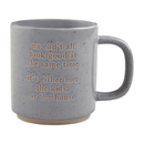 A gray speckled stoneware mug with the embossed humorous text: 'we can't all look good at the same time it's either me, the kids, or the house'.