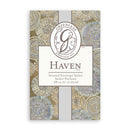 A close-up product image of a Greenleaf Haven Scented Envelope Sachet. The sachet features an ornate patterned background in muted tones of blue, green, and beige, resembling swirling floral or natural motifs. A central rectangular label, outlined in a darker shade, showcases the "Greenleaf" logo with a stylized "G" and "Established 1975" above the word "HAVEN" in large, elegant lettering. Below "HAVEN" it reads "Scented Envelope Sachet Sachet Parfumé" and ".68 cu.in. 11.09 ml."