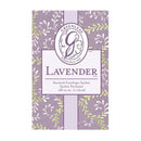 A close-up product image of a "Greenleaf Lavender Scented Envelope Sachet." The sachet's packaging features a background pattern of green leafy branches against a soft purple backdrop. A rectangular central label, outlined in a darker purple, displays the "Greenleaf" logo with a stylized "G" and "Established 1975" at the top. Below the logo, "LAVENDER" is prominently written in large, elegant lettering. Underneath, it states "Scented Envelope Sachet Sachet Parfumé" and ".68 cu.in. 11.09 ml."