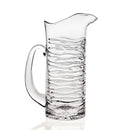 Clear Godinger glass pitcher with a modern silhouette and handle, shown on a white background.