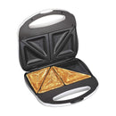 An open white and black electric sandwich maker with two non-stick triangular plates, currently holding two cooked, sealed pocket sandwiches.