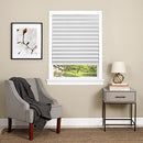 White pleated window shade with a cordless, easy-to-install design, featuring a clear plastic clip for adjusting the length. The durable, light-blocking material provides privacy and room darkening, making it ideal for bedrooms, offices, and living spaces.