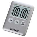 A small, grey digital kitchen timer with a large LCD screen and three control buttons on the front.
