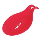 Red silicone spoon rest with the word "MEAT" on it.