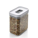 A clear rectangular food storage container filled with mixed rice, sealed with a gray and white airtight locking lid.
