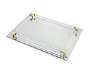 A rectangular mirrored tray with a border made of clear acrylic rods and gold-toned corner accents.