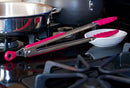 Stainless steel kitchen tongs with vibrant pink silicone tips and grip. Features a scalloped edge for a secure hold and a locking mechanism for easy storage.