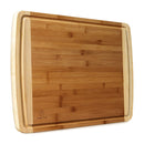 Indigo True Bamboo Cutting Board, a rectangular board with visible bamboo grain, a juice groove around the perimeter, and lighter colored edges.