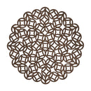 A round placemat made of thin, dark brown material, featuring an intricate laser-cut geometric pattern of interlocking circles and squares.