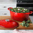 Red enameled 7-quart cast iron Dutch oven with matching lid.