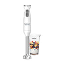 A Cuisinart Smart Stick Hand Blender in white with a metallic silver blending shaft is positioned vertically. Below it, a clear Cuisinart blending cup is filled with white yogurt topped with chopped peaches and blueberries. The blender features "Cuisinart Smart Stick" branding, an "ON" button, and a lock symbol at the top, all set against a clean white background.