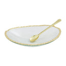 Mud Pie Gold Glass Dip Bowl Set featuring a clear textured glass oval bowl with a gold-painted rim and a small gold-colored spoon resting inside.