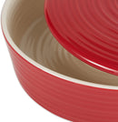 A round, red stoneware tortilla warmer with a ribbed texture, a matching lid, and a small round knob handle.