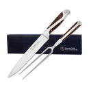 Hammer Stahl 2-piece carving set featuring a long, sharp carving knife and a matching carving fork, both with elegant wood and white handles, presented in a dark gift box.