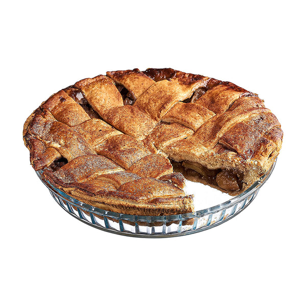 A round, transparent glass pie dish with a fluted edge, thick base, and sloped sides for even baking. Its clear design allows easy monitoring and doubles as a serving dish.