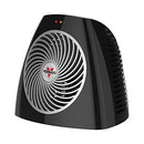 A compact, black Vornado personal space heater with a silver fan grill and red and amber indicator lights on top.