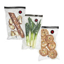 Three clear Zwilling Fresh & Save vacuum food storage bags with red vacuum valves and black zip closures.
