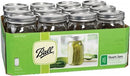 A green cardboard box containing a 12-pack of Ball brand clear glass wide mouth mason jars with silver lids.