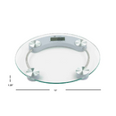 A round, transparent glass digital bathroom scale with a central LCD screen and four metallic feet.