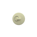 Round beige lavatory and sink stopper with pull ring.