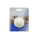 Round beige lavatory and sink stopper with pull ring.